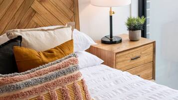 1 bedroom, desk, iron/ironing board, travel crib