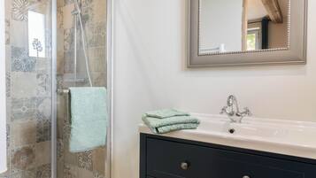 Shower, hair dryer, towels, soap