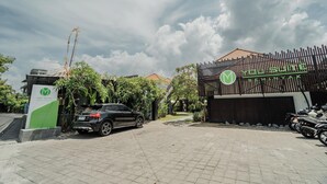 A gated entrance with a sign for 'You Suite Seminyak'. - You Suite Seminyak (Legian)