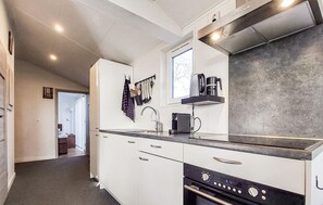 Fridge, stovetop, dishwasher, coffee/tea maker