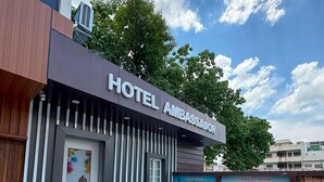 A modern hotel entrance with a sign reading "HOTEL AMBASSADOR". - Hotel Ambassador  (Varanasi)