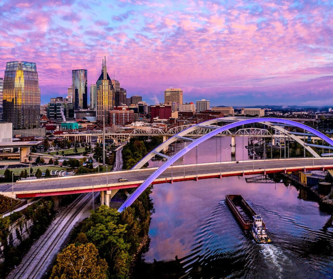 A cityscape with a prominent bridge and a river.