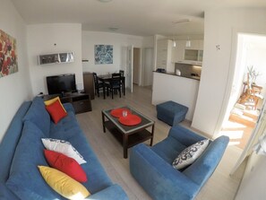 Apartment (One Bedroom Apartment with Sea View a) | Living room | 32-inch flat-screen TV with satellite channels - Apartment Precious View (Dubrovnik)