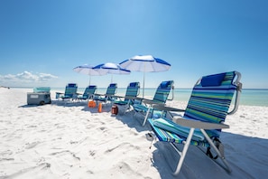 On the beach, sun loungers, beach towels