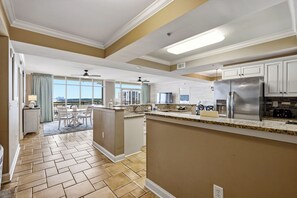 A modern kitchen with a large island, built-in appliances, and a view to the outside. - 🏖️Oceanfront~Infinity Pool~Awesome Amenities~ North Beach Resort 1003🏖️ (North Myrtle Beach)