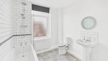Shower, hair dryer, towels, shampoo