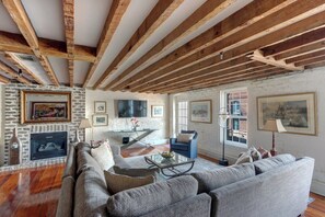 TV, fireplace - Bay Street Flat, Historic | Riverfront View (Savannah)