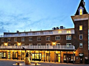 Experience the charm of this traditional hotel, featuring a striking corner tower and a brick facade.