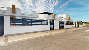 Stylish building with a secure entrance and serene surroundings.