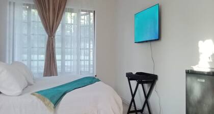 En-suite family size room with pool view.