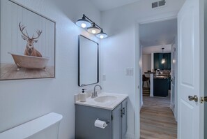 Hair dryer, towels, shampoo, toilet paper