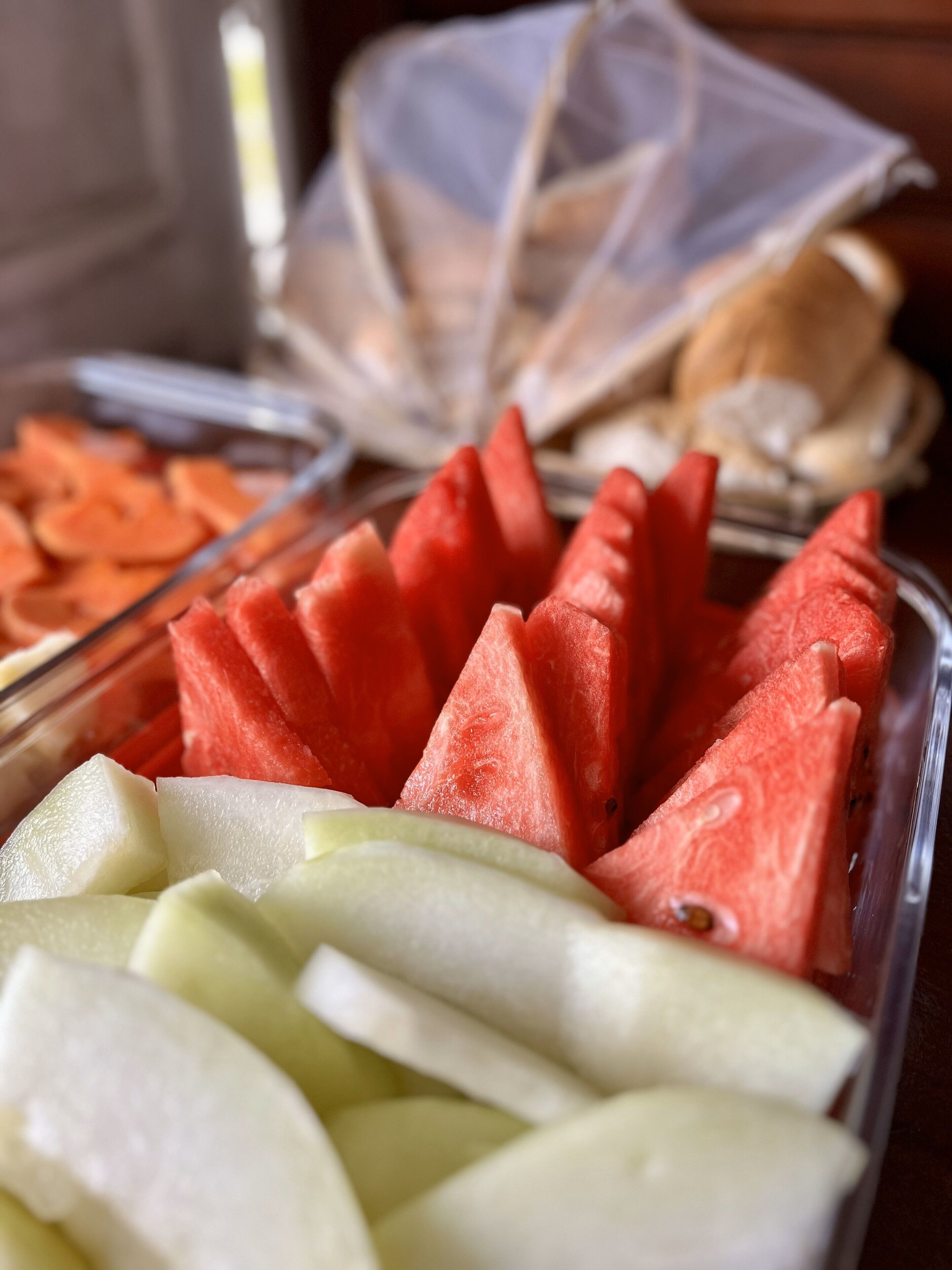 A fruit platter with watermelon and apples.