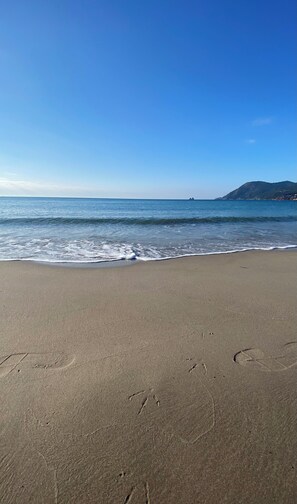 On the beach, sun loungers