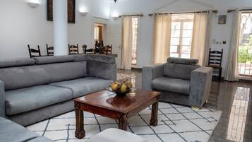 Presidential Suite, Garden View | Living area | TV