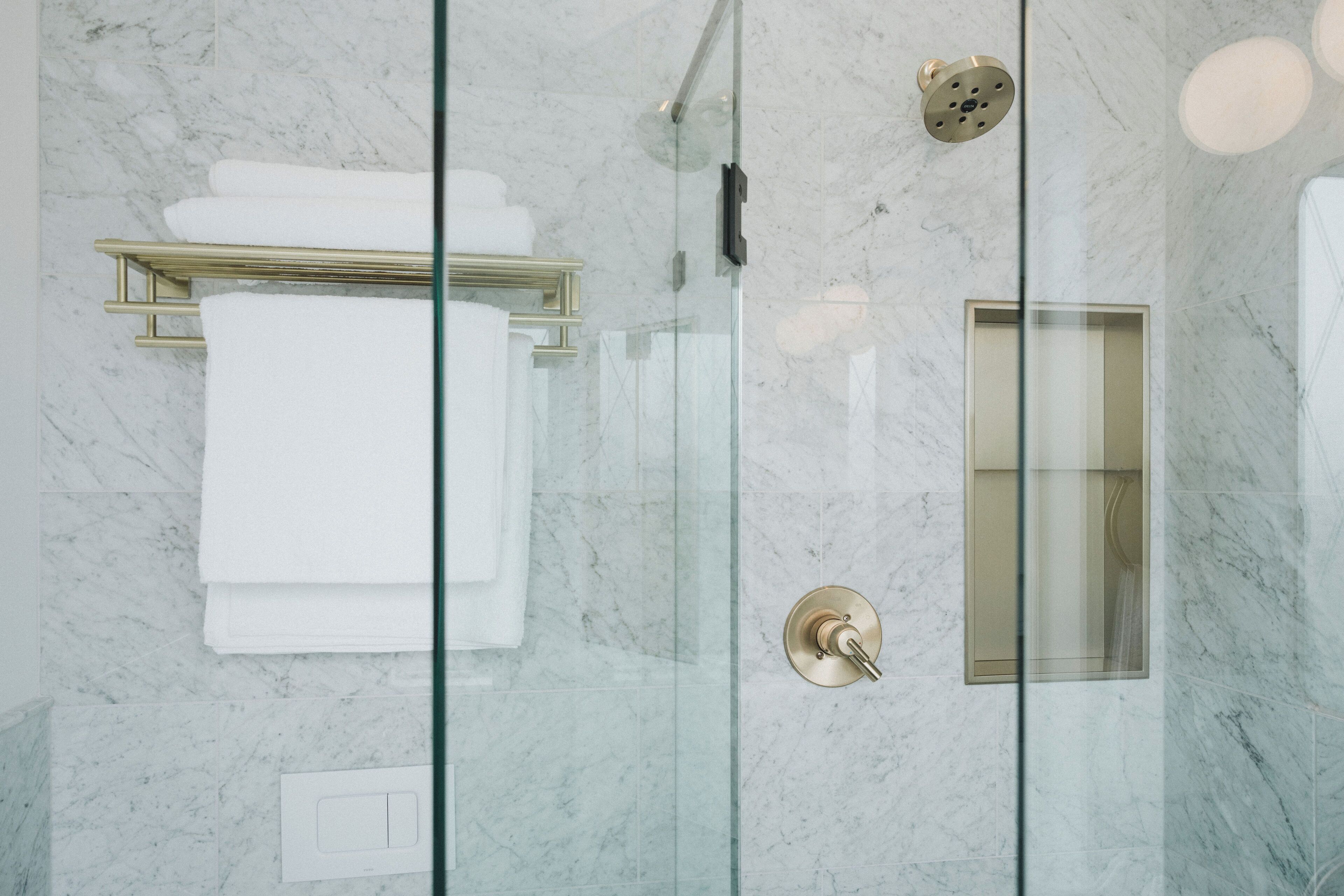 Shower, rainfall showerhead, hair dryer, towels