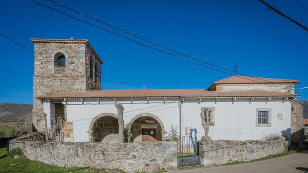 A stone building with a bell tower, arched doorways, and a small gate. - Country House 'El Corcal' with Mountain View, Private Terrace and Wi-Fi (Triollo)