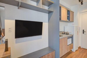 Apartamento conforto, vista para a cidade | Área de estar