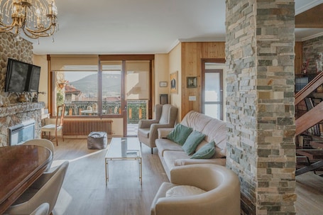 TV, fireplace. Country Home 'El Cedro' with Mountain View, Private Terrace and Wi-Fi