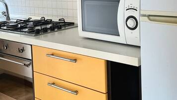 Fridge, oven, dishwasher, dining tables