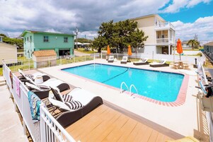 Seasonal outdoor pool, open 8:00 AM to 9:00 PM, pool umbrellas