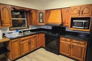 Fridge, microwave, oven, stovetop - Unit 2 at Oilgate at Oakdale (Akron)