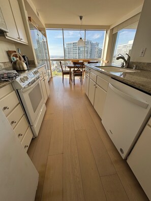 Fridge, microwave, oven, stovetop - Beach and city views in condo with backyard access to beach and walkable town. (Coronado)
