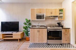 Fridge, microwave, stovetop, coffee/tea maker