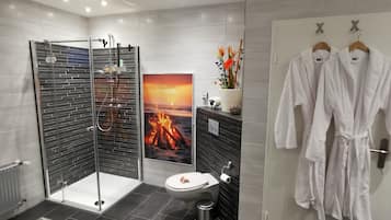 Shower, hair dryer, towels, soap
