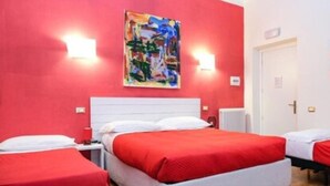 A hotel room with a red wall, a white headboard, and a painting above the bed. There are two beds with red bedding and white pillows. - Lia Rooms (La Spezia)