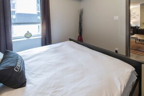 1 bedroom, desk, iron/ironing board, travel crib