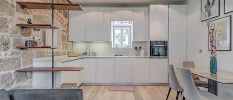 Deluxe Apartment | Living area | 100-cm flat-screen TV with cable channels, Netflix, streaming services