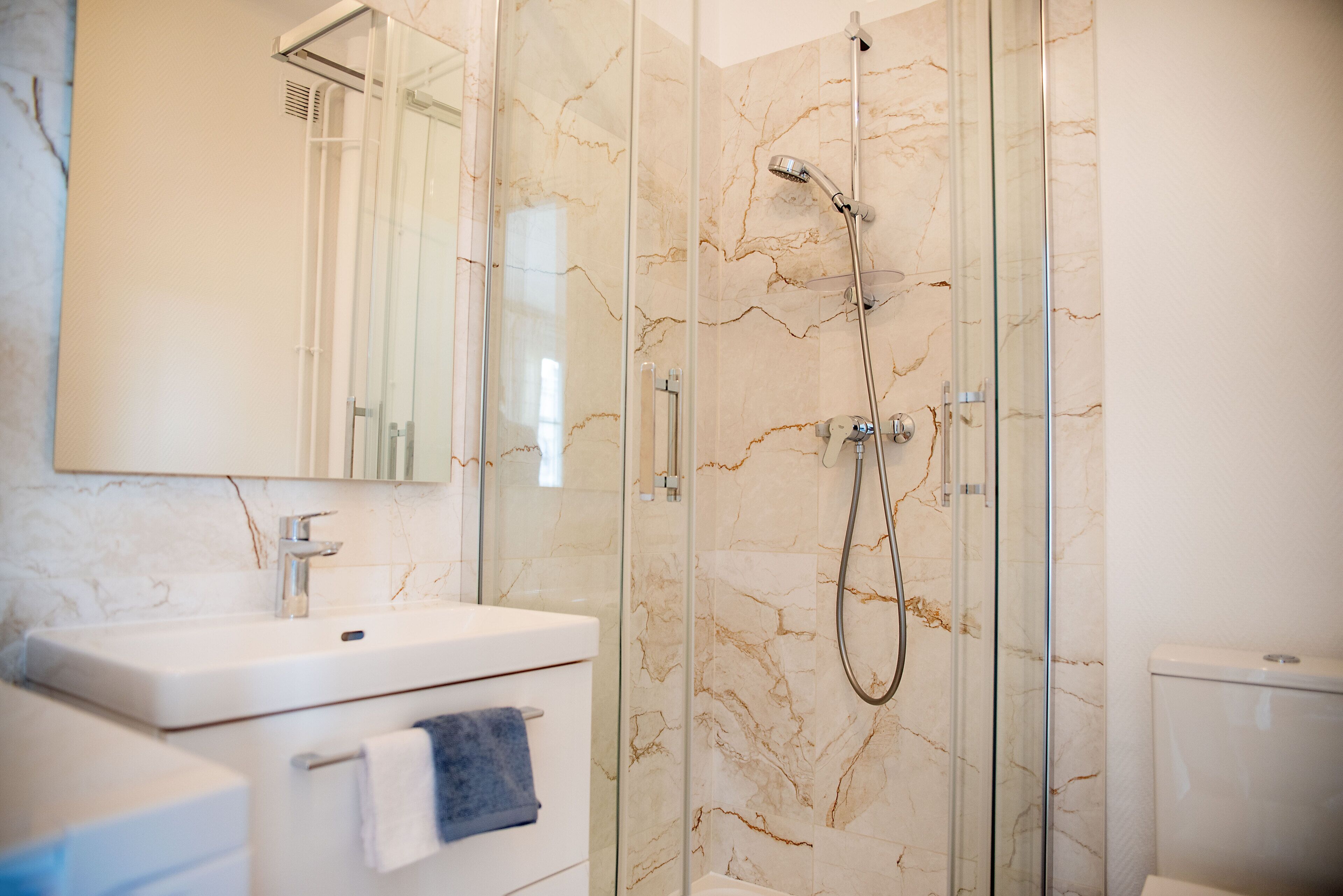 Shower, hair dryer, towels, soap