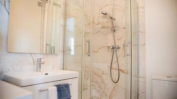 Shower, hair dryer, towels, soap