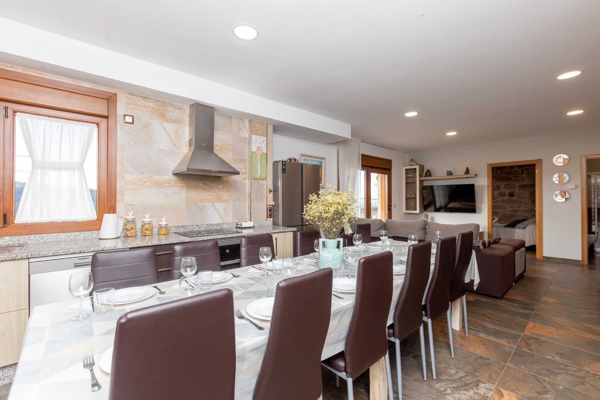 A modern kitchen with a dining area, granite countertops, and a large island.