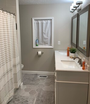 Shower, towels, soap, toilet paper