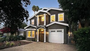 A two-story house with a front entrance, a garage, and a landscaped driveway. - Stunning Sherman Oaks Home minutes from all LA has to offer. Pool Oasis! (Los Angeles)