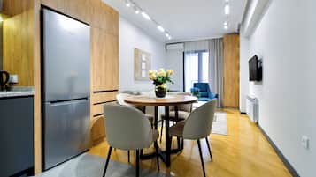 Standard Apartment, Balcony, City View | Living area | 52-cm Smart TV with digital channels