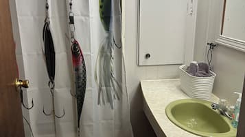 Shower, hair dryer, towels, shampoo