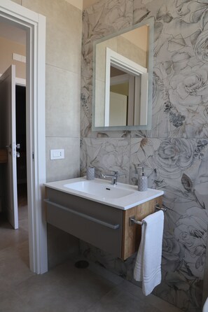 Shower, eco-friendly toiletries, hair dryer, bidet