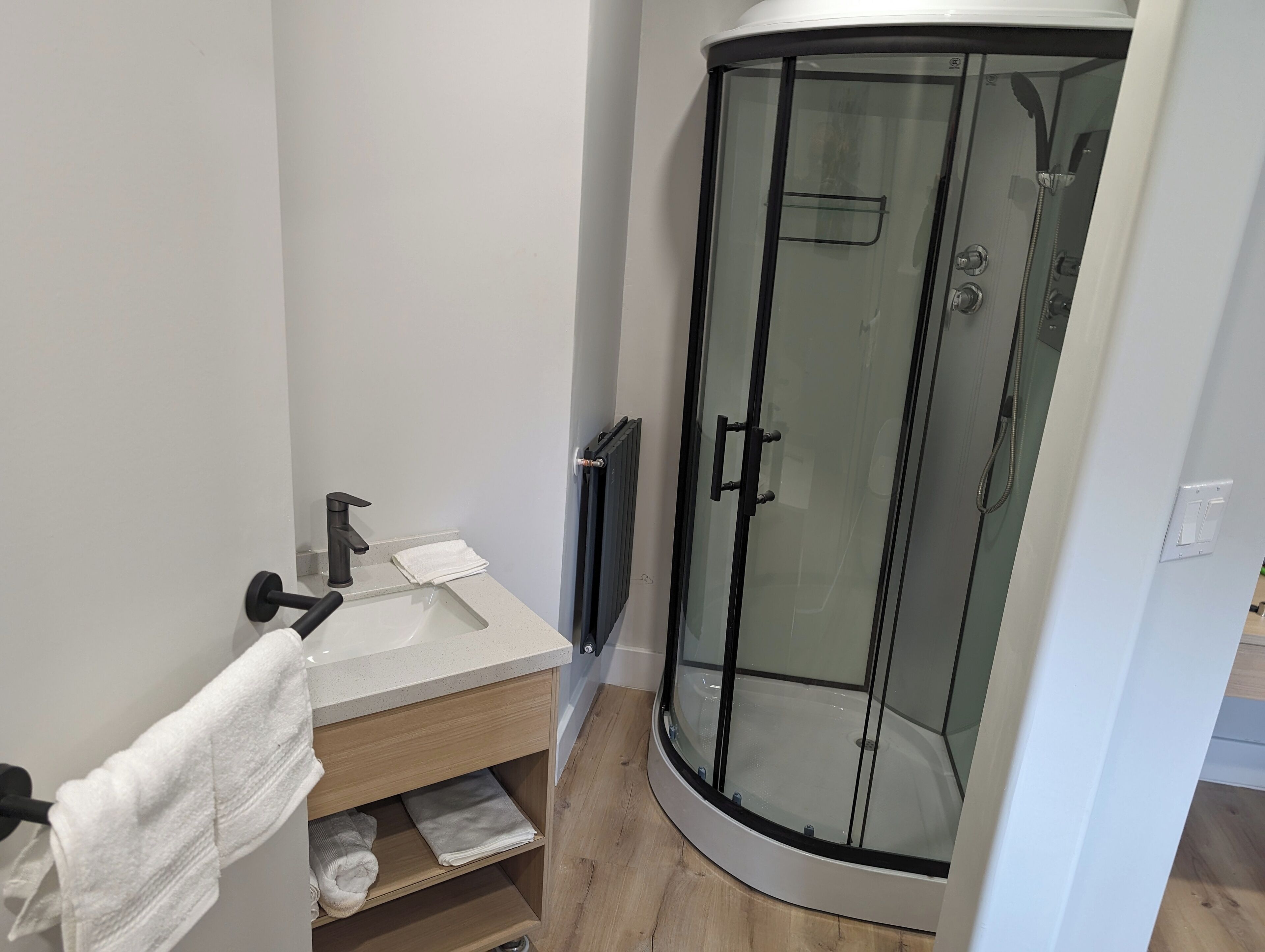 Shower, rainfall showerhead, towels, soap