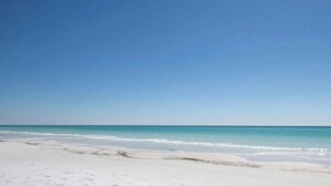 A beach with clear blue water and white sand. - Waterfront/Walk to Public Beach! (Seagrove Beach)