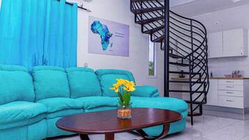 Exclusive Apartment, 2 Bedrooms, Resort View | Living area | 32-inch Smart TV with cable channels