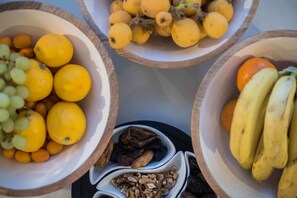 Three bowls containing various fruits and nuts. - Boutique Guesthouse Sveti Petar (Solta)
