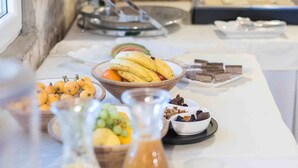 A breakfast buffet with various food items and beverages. - Boutique Guesthouse Sveti Petar (Solta)