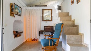 A staircase with a wooden chair in the foreground. - Lovely home in Canillas de Albaidas (Canillas de Albaidas)