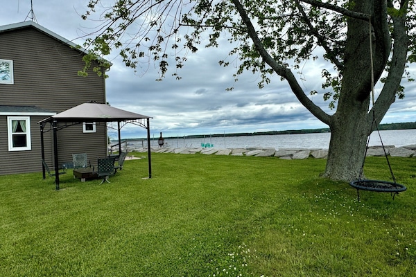 Lush lawn for yard games, gazebo for shade and hanging out while the sun sets