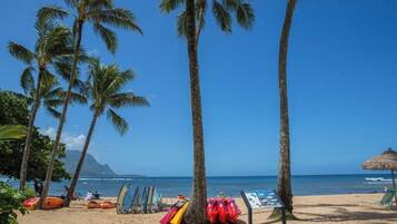 On the beach, sun loungers, beach towels