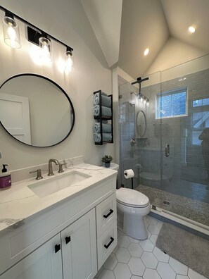 Shower, hair dryer, towels, soap