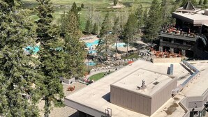 A resort with a pool, outdoor seating, and a view of a golf course. - Everline Resort & Spa: Deluxe Two-Bedroom Penthouse
Ski In/Out, Golf, Spa, Pool (Olympic Valley)