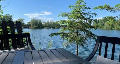 Serene river apartment walking distance to downtown and Heartland Trail!
